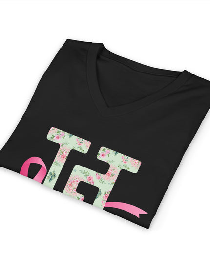 Folded black breast cancer awareness V-neck t-shirt showing the floral HG logo and pink ribbon up close